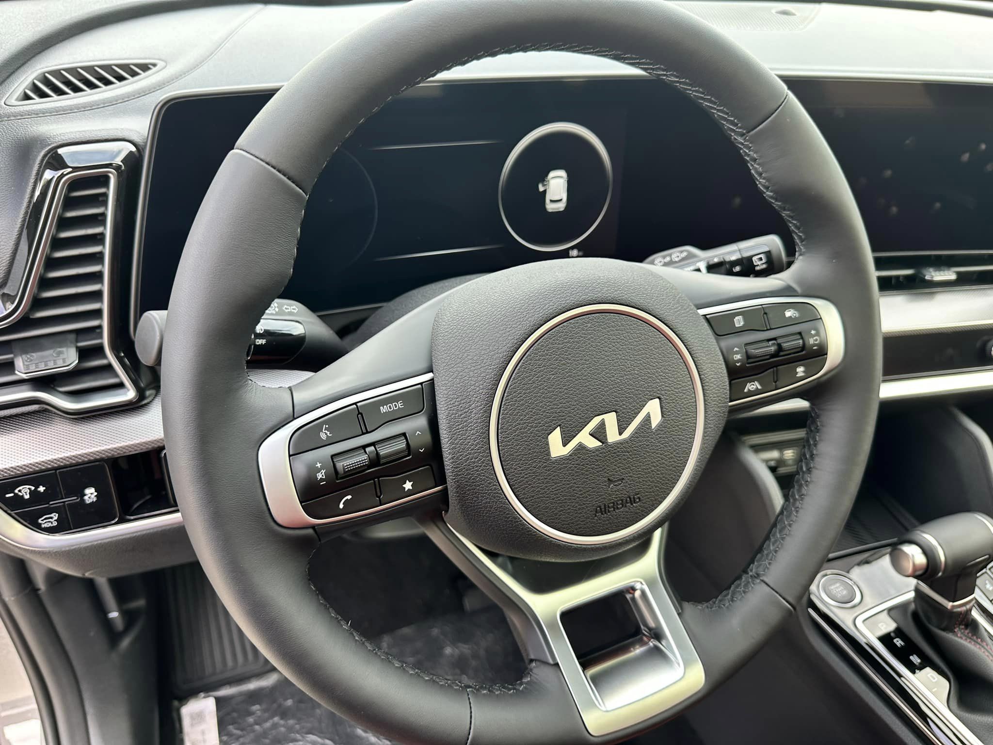 2024 Kia Sportage - Wolf Gray/Carmine Red Interior - SX Prestige Trim - Steering Wheel Close Up