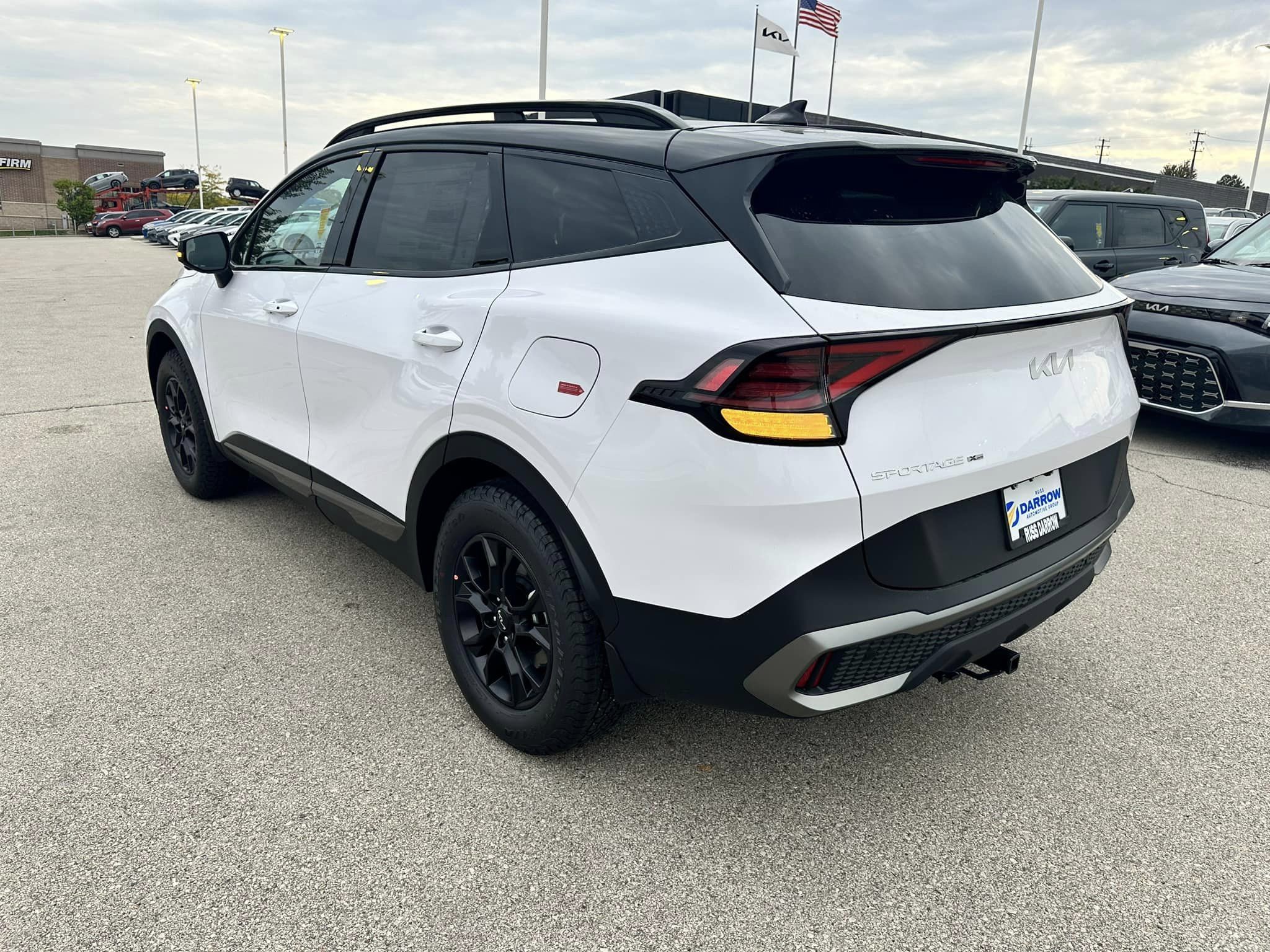 2024 Kia Sportage - Glacial White Pearl - X-Pro Prestige Trim - Rear Driver's View