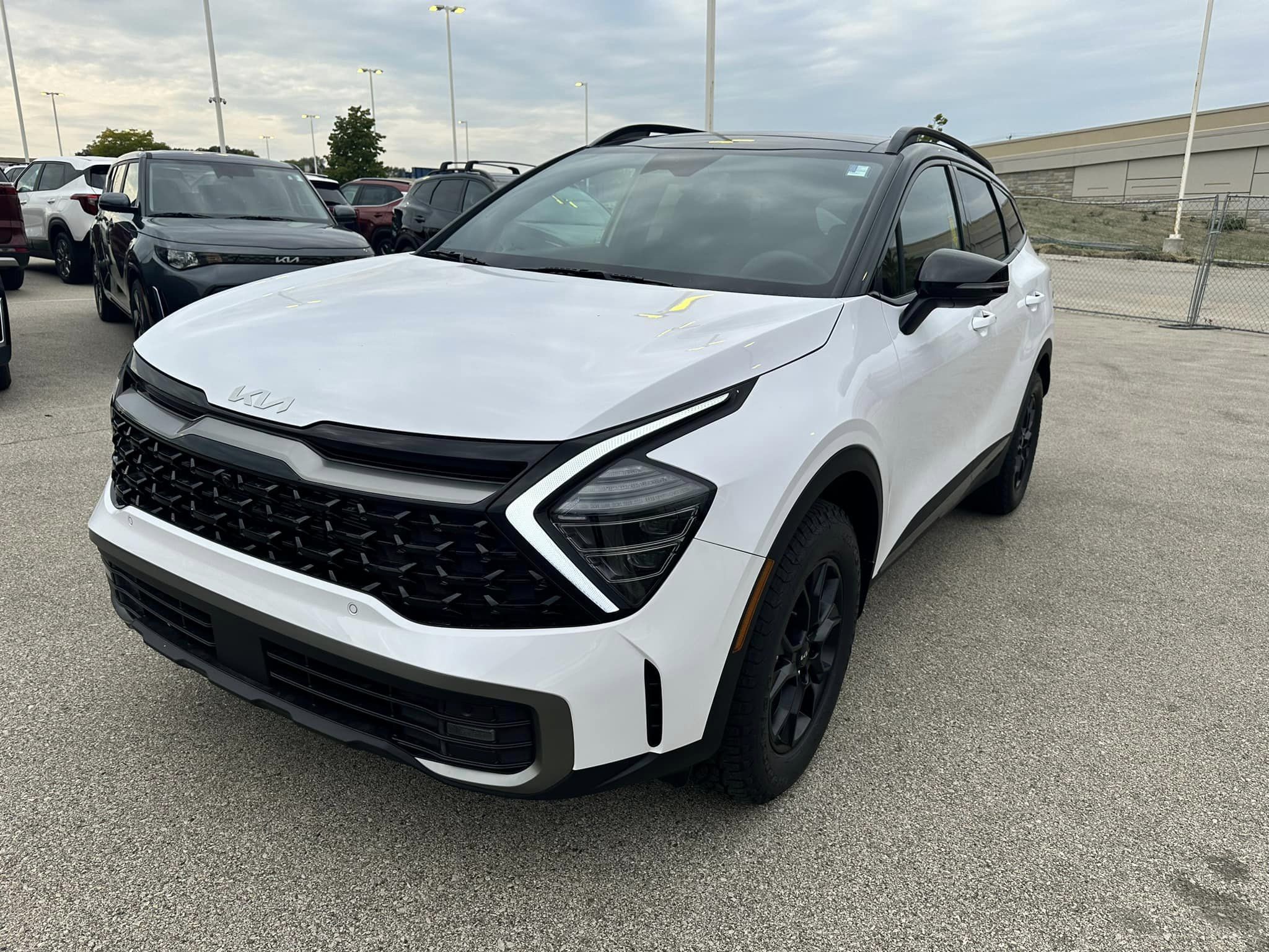 2024 Kia Sportage - Glacial White Pearl - X-Pro Prestige Trim - Driver's Side Front View