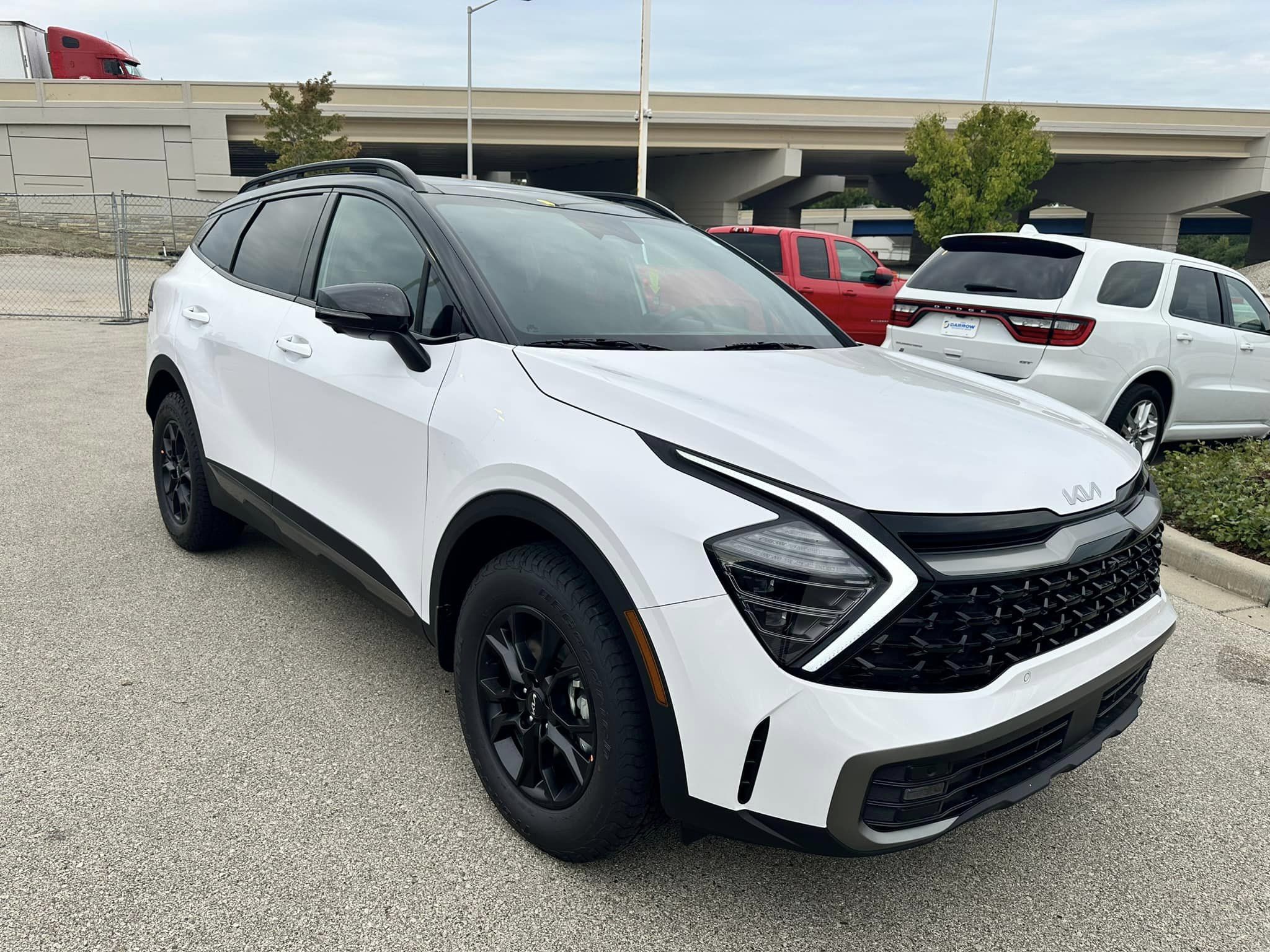 2024 Kia Sportage - Glacial White Pearl - X-Pro Prestige Trim - Passenger Side Front View